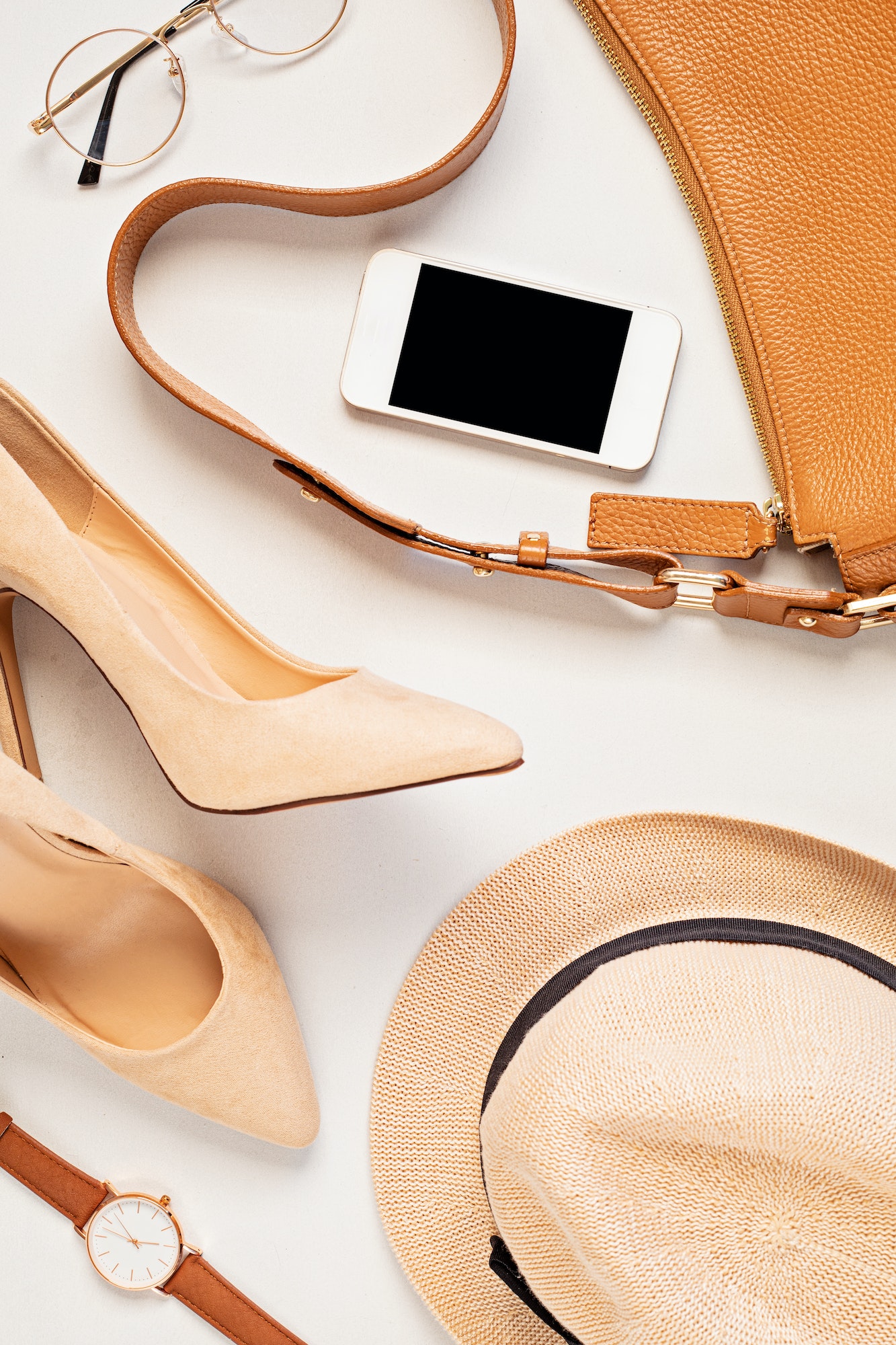 Flat lay with woman fashion accessories in neutral colors. Beauty blog, style, trends